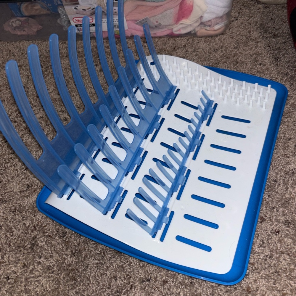 Blue and White baby drying rack and baby pacifiers never used.